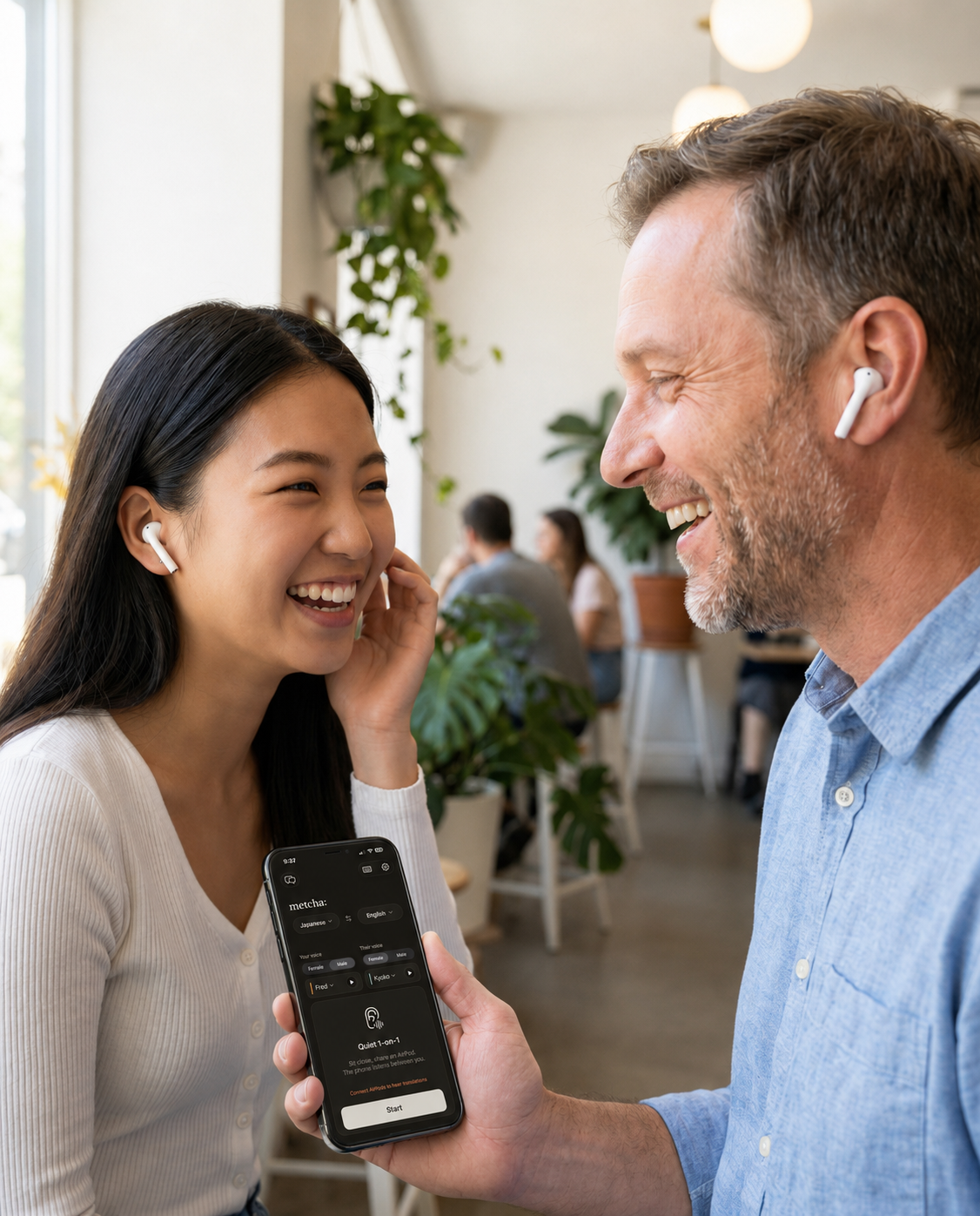 A couple in conversation with one earbud each, using metcha to bridge two languages.
